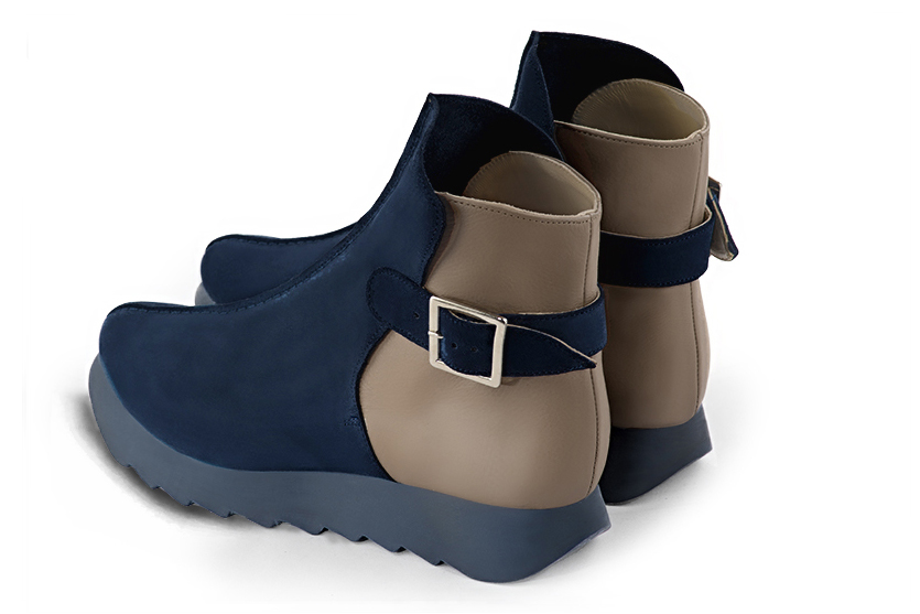 Women's navy blue and bronze beige elegant ankle boots, with buckles at the back. Round toe. Thick rubber soles - Rear view